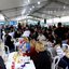 Imagem de várias pessoas sentadas em cadeiras, abaixo de uma tenda, no evento na Ilha Diana